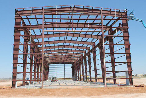 Immagazzino di strutture in acciaio prefabbricato con pannello sandwich, rivestimento del tetto in vetro di lana e kit di costruzione in acciaio Q235/Q345